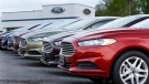 In this Wednesday, May 8, 2013 file photo, a row of new 2013 Ford Fusions are on display at an automobile dealership in Zelienople, Pa. (Keith Srakocic/AP, File)