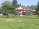 OPP are parked outside of a home in Zorra Township, Ont, for an active death investigation on Tuesday, June 2, 2015. (Marek Sutherland / CTV London)