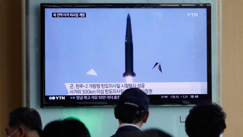 People watch South Korea's missile test