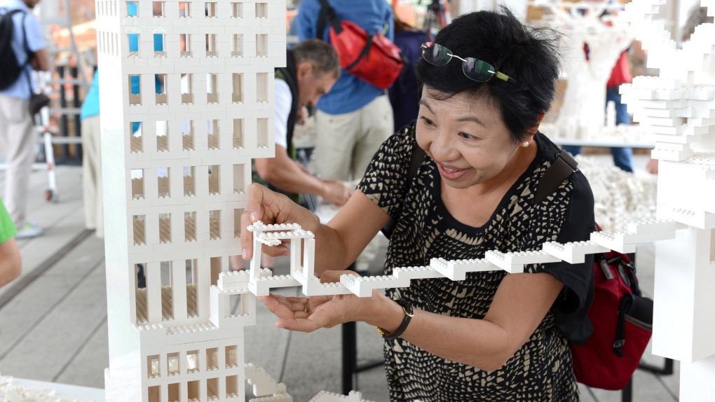 Woman builds Lego building