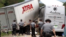 Authorities investigate the scene of a fatal collision between a tractor-trailer and a tour bus on Interstate 380 near Tobyhanna, Pa., Wednesday, June 3, 2015. (Jake Danna Stevens / The Times & Tribune via AP)