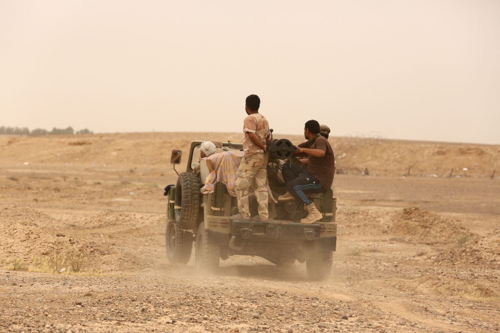 Shiite militia patrol outskirts of Fallujah