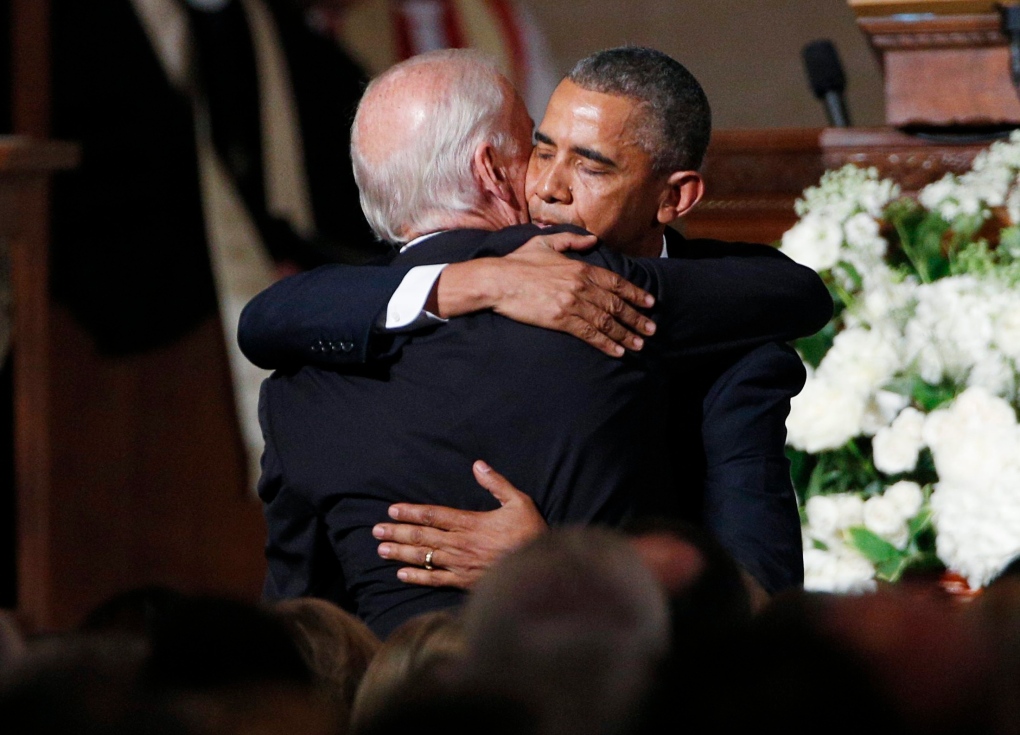 Barack Obama hugs Joe Biden after eulogy