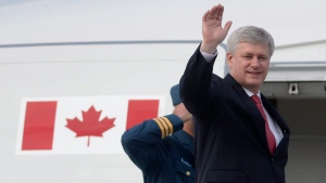 Canadian Prime Minister Stephen Harper waves as he boards a plane in Ottawa on Friday, June 5, 2015. Harper is travelling until June 11 visiting Ukraine, Germany for the G7 meeting, Poland and Italy. (Adrian Wyld/THE CANADIAN PRESS)