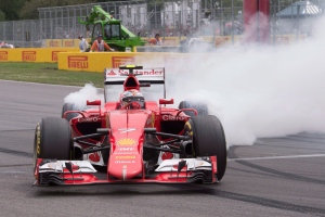 Ferrari driver Kimi Raikkonen of Finland spins his tires after sliding his car at the hairpin during the Canadian Grand Prix in Montreal on Sunday, June 7, 2015. THE CANADIAN PRESS/Jacques Boissinot