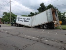 A recycling truck that buckled prompted the closure of Wyandotte Street East in Windsor, Ont. on Friday, June 12, 2015. (Michelle Maluske / CTV Windsor)