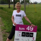CTV's Jan Sims gets warmed up for her part of the OneRun as she waits for Theresa Carriere to arrive near Watford, Ont. on Friday, June 12, 2015. (Norman James / CTV London)