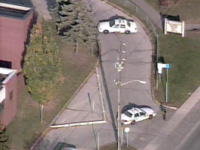 Police cars are evident outside R.H. King Academy in Scarborough follow a lockdown triggered by a reported handgun sighting on Tuesday, Nov. 4, 2008.