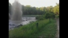 Natural gas bubbles up from a pond in Lambton County, Ont. on Wednesday, June 17, 2015, in this image taken from video provided by Jamie Reitknecht and filmed by Will Milliken Wentz.