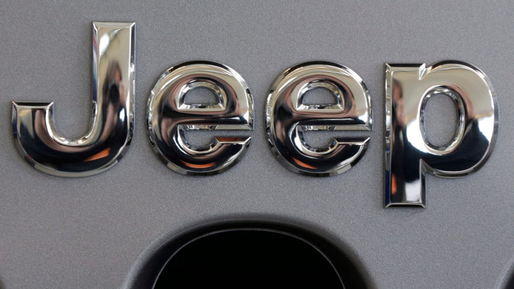 Jeep logo on the grill of a Jeep Wrangler