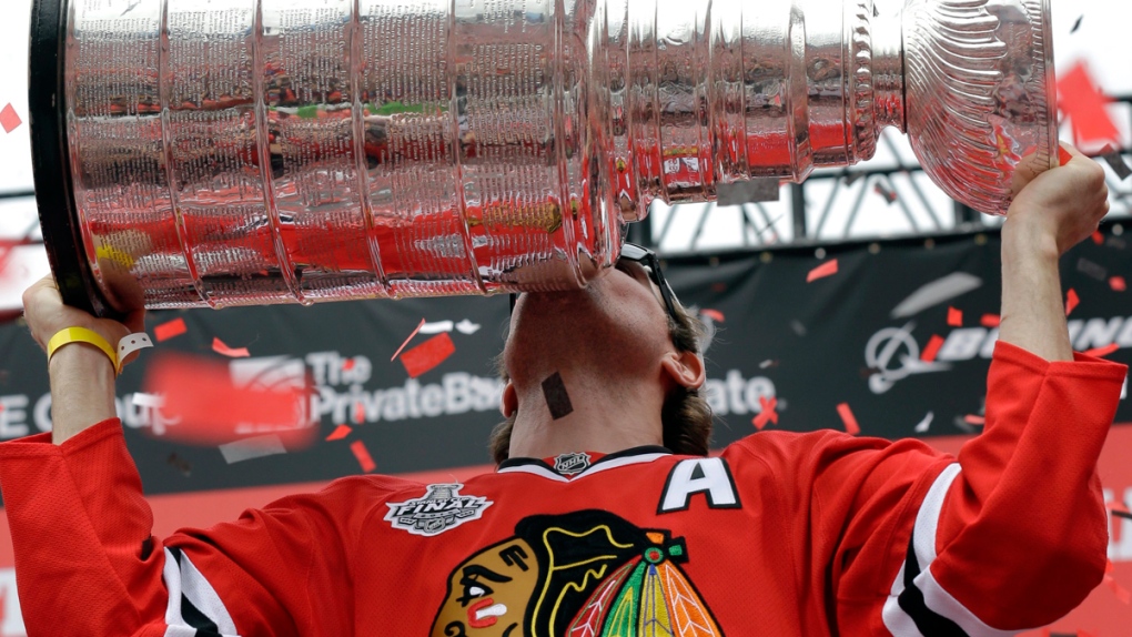 Patrick Sharp kisses the Stanley Cup