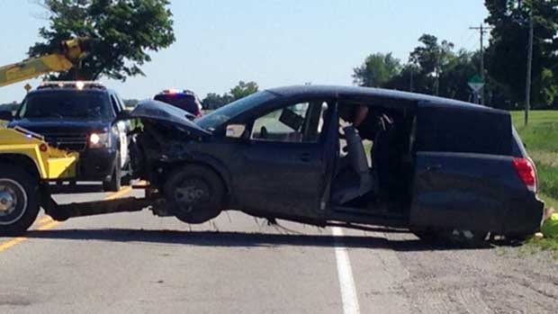 A minivan is towed from the scene after a fatal crash near Clinton, Ont. on Wednesday, June 24, 2015. (Scott Miller / CTV London)