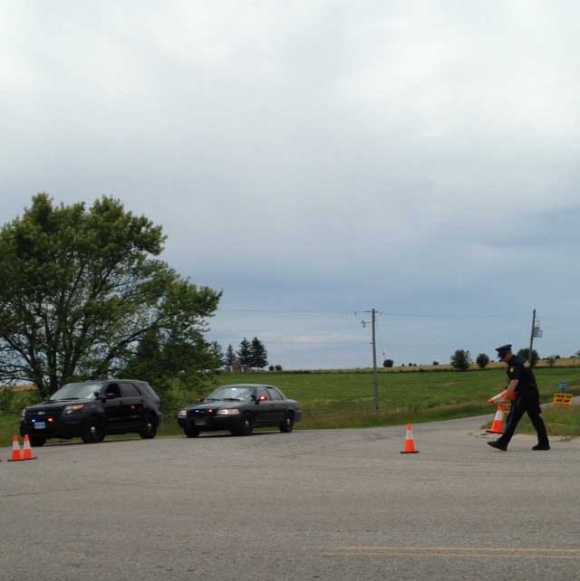 OPP block Westminster Drive at Westchester Bourne as they investigate a suspicious death in Middlesex County, Ont. on Thursday, June 25, 2015. (Reta Ismail / CTV London)
