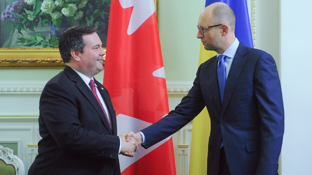 Jason Kenney shakes hands with Ukranaine PM