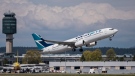 A Westjet Airlines Boeing 737-800 jetliner takes off from Vancouver International Airport, Richmond, B.C., May 4, 2015. (The Canadian Press/Bayne Stanley)