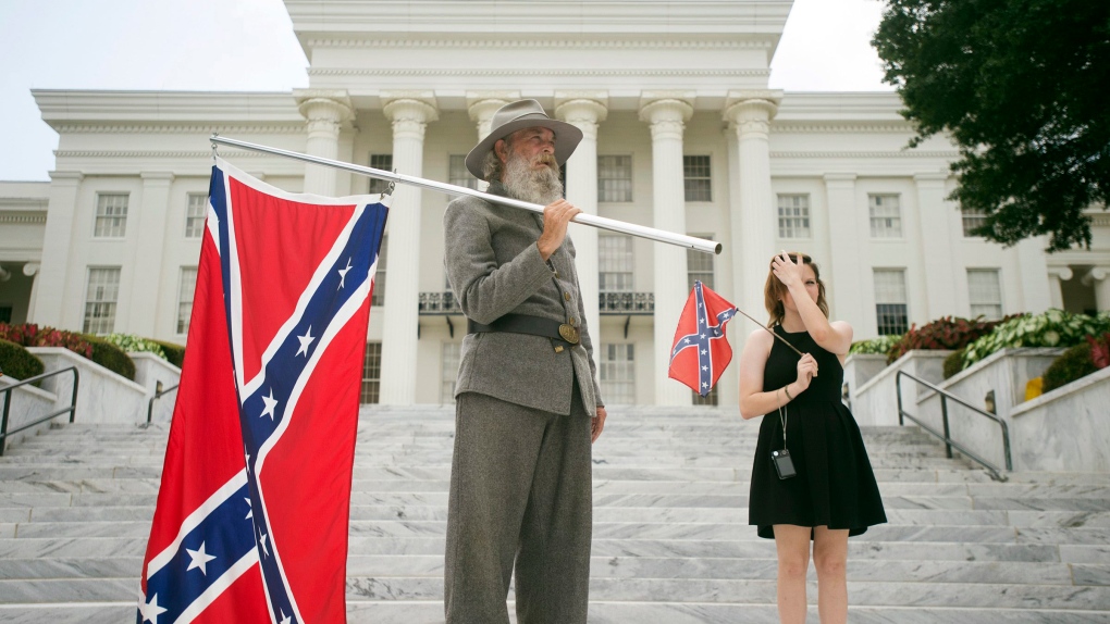 Man holds Confederate flag in Alabama