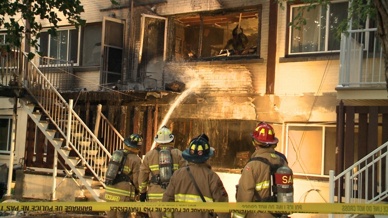 Firefighters battle a blaze at an apartment complex in Vanier that sent one person to hospital and left three others homeless (Bryan McNab/CTV Ottawa, June 29, 2015) 