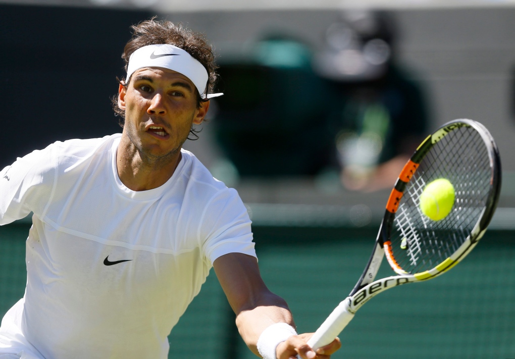 Nadal plays a return at Wimbledon