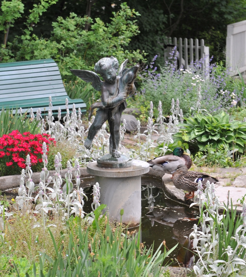 A cast-iron statue of a cherub holding a dolphin stolen from outside Eldon House in London, Ont. is seen in this image provided by the museum.