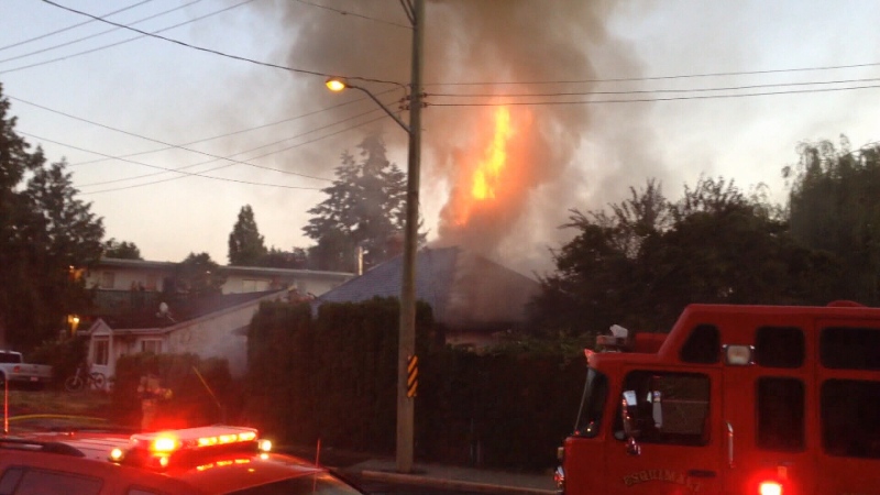Crews battle a blaze in the 600-block of Admirals Road in Esquimalt Wednesday, July 1, 2015. (CTV Vancouver Island)
