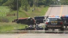 A van is seen on its side after a fatal collision involving a pedestrian on Napperton Drive west of Strathroy, Ont. on Thursday, July 2, 2015. (Gerry Dewan / CTV London)