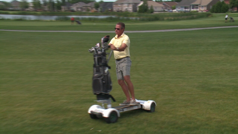 Gary Sager rides a GolfBoard at the eQuinelle Golf Course in Kemptville, Ontario. July 3, 2015