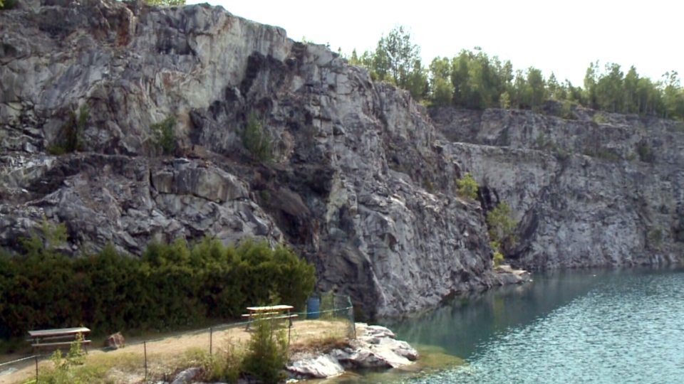 Dad dies after jumping into quarry.