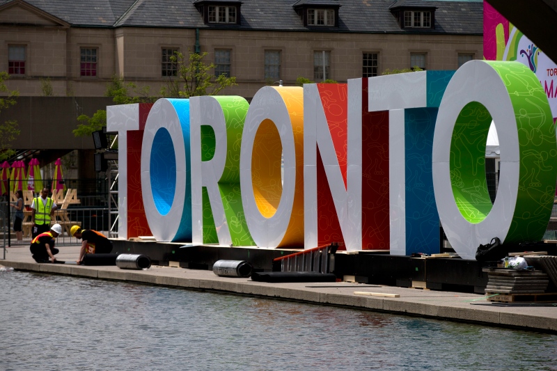Workers erect giant letters spelling out Toronto in Nathan Phillips Square as they prepare for the Pan Am Games, Wednesday, July 8, 2015. (AP / Rebecca Blackwell)