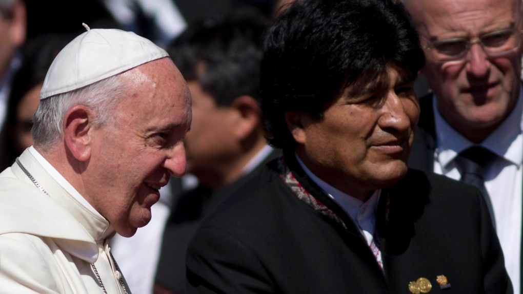 Evo Morales escorts Pope Francis