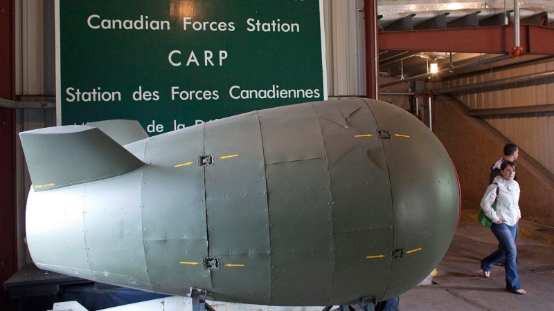 People walk past an MK-4 Atomic Bomb replica while exiting the Diefenbunker museum in Carp, Ontario on Sunday, June 6, 2010. (Pawel Dwulit / THE CANADIAN PRESS)
