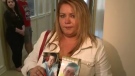 Mary Anne MacIntyre holds pictures of her sons Logan and Morgan, who were killed in the crash.