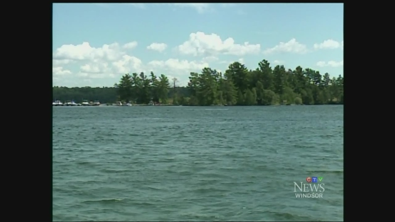 Boats line the shore along the St. Lawrence River near Brockville, Ont. on Sunday, July 19, 2015.