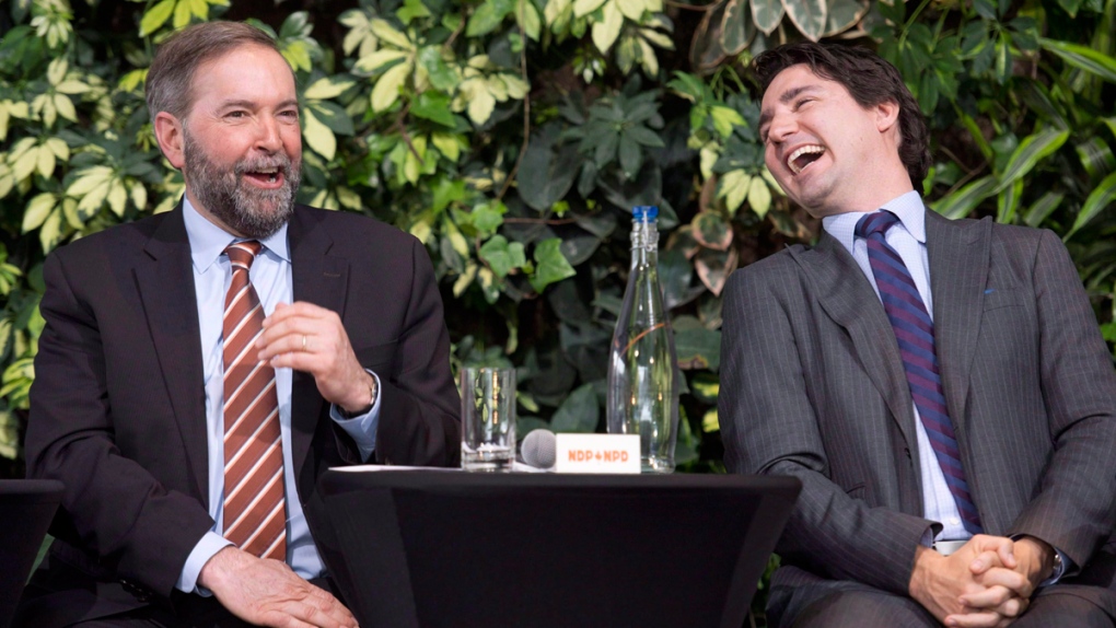 Mulcair, left, and Trudeau laugh in Ottawa