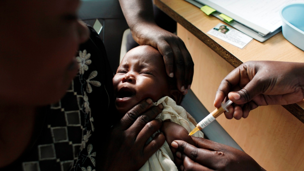 baby receives malaria vaccine in Kenya