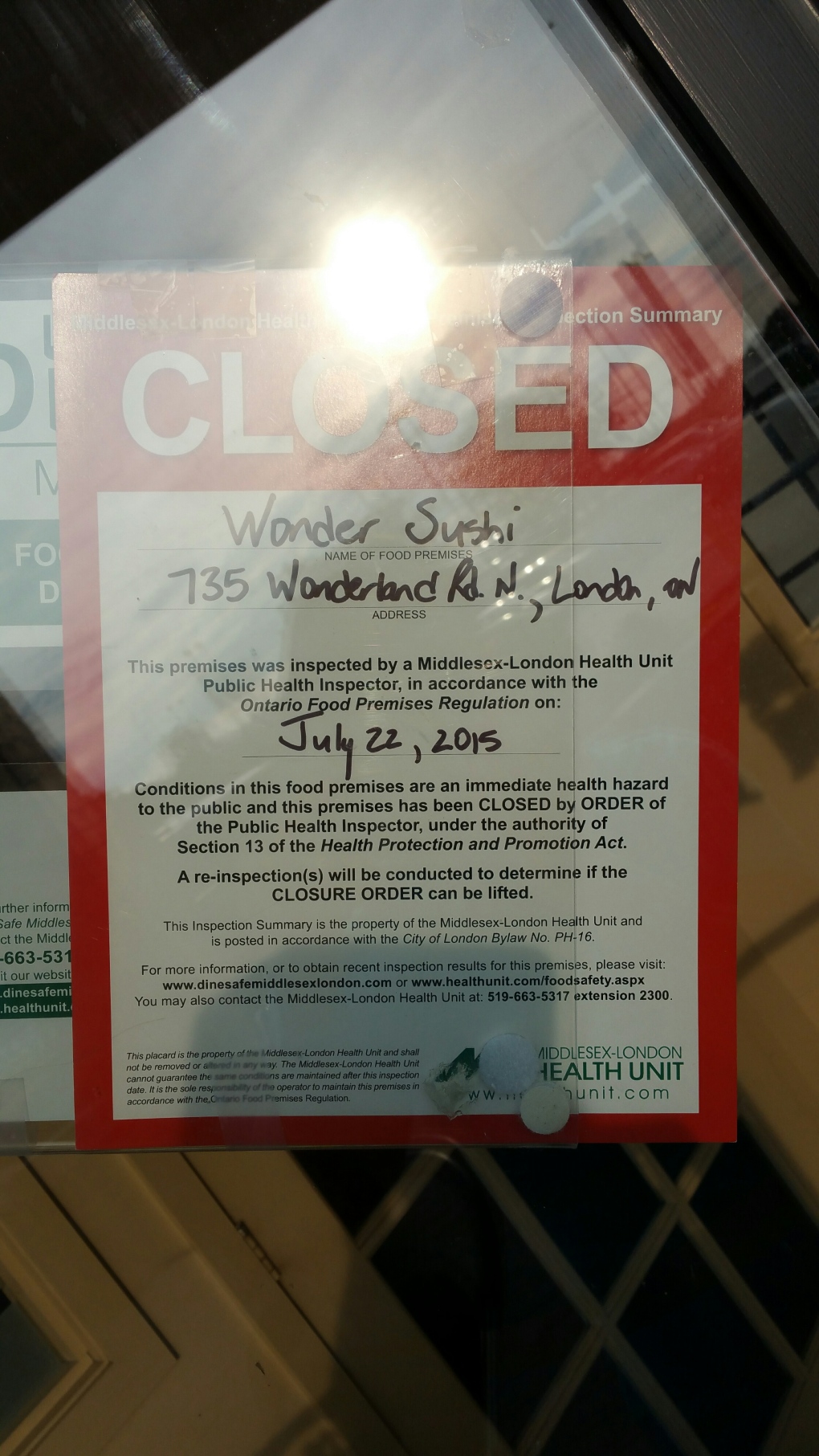 MLHU closure sign on Wonder Sushi