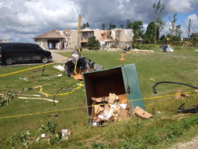 Storm damage and debris are shown at a home in Teviotdale on Monday August 3, 2015.