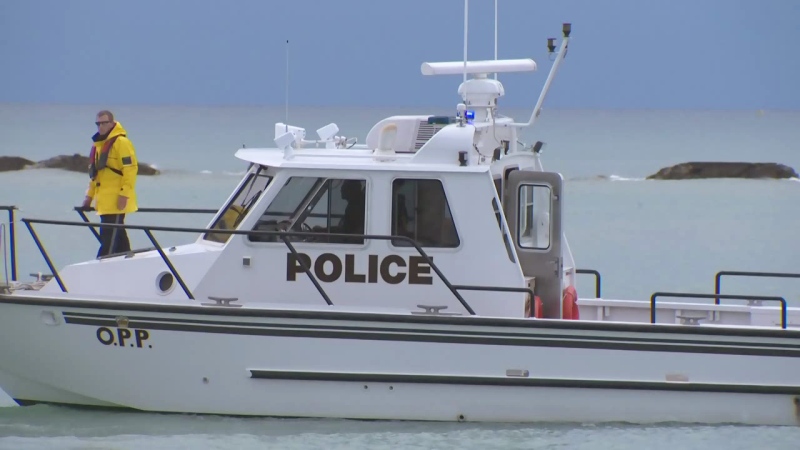 An OPP boat searches for a missing swimmer near Station Beach in Kincardine on Sunday, Aug. 2, 2015.