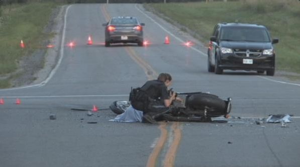 Police investigate a crash that left two people dead near Windham Centre, Ont., on Thursday, Aug. 6, 2015.