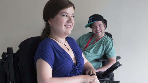 Stella Palikarova, left, and Andrew Morrison-Gurza are pictured in Stella's Toronto apartment building on Thursday, June 18, 2015. A party meant to give people with disabilities a chance to explore and express their sexuality is shining a spotlight on an enduring and often ignored barrier for those with physical and mental limitations.But though guests at the Deliciously Disabled party, to be held in Toronto next week, are free to act on their consensual desires, don't call it an orgy. THE CANADIAN PRESS/Chris Young