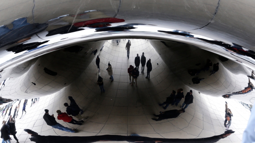 People go through Chicago Cloud Gate