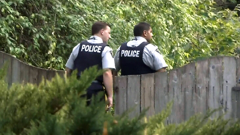 Police respond after a 70-year-old Surrey, B.C., woman was sexually assaulted and robbed in her home. Aug. 12, 2015. (CTV)