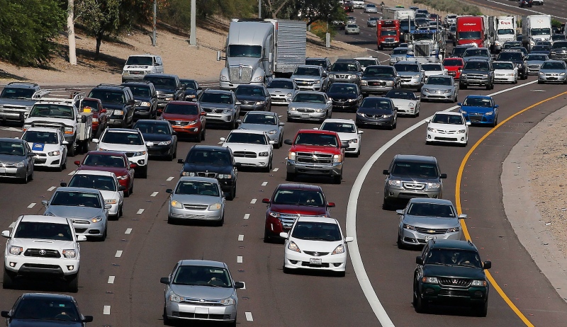 In this June 24, 2015, file photo, afternoon rush our traffic moves along a highway in Phoenix. (AP / Ross D. Franklin, File)