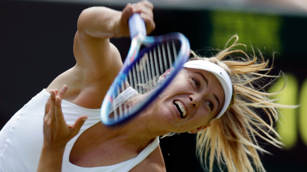 Maria Sharapova serves at Wimbledon