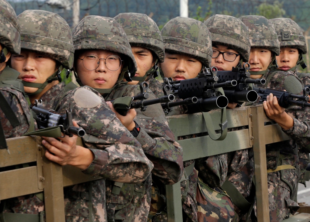 South Korea troops pull back from brink