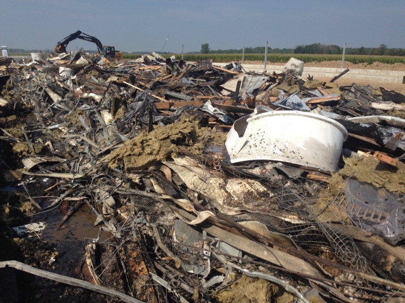 Debris from a barn fire on a poultry farm is shown on Monday September 7, 2015.