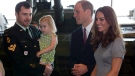 The Duke and Duchess of Cambridge chat with wounded veteran Jody Mitic (left) holding his daughter, at the War Museum in Ottawa, on Saturday, July 2, 2011. (Frank Gunn / THE CANADIAN PRESS)
