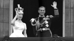 Queen Elizabeth II and Prince Philip, Duke of Edinburgh, as they wave to supporters from the balcony at Buckingham Palace, following her coronation at Westminster Abbey. London, June. 2, 1953. (AP / Leslie Priest)