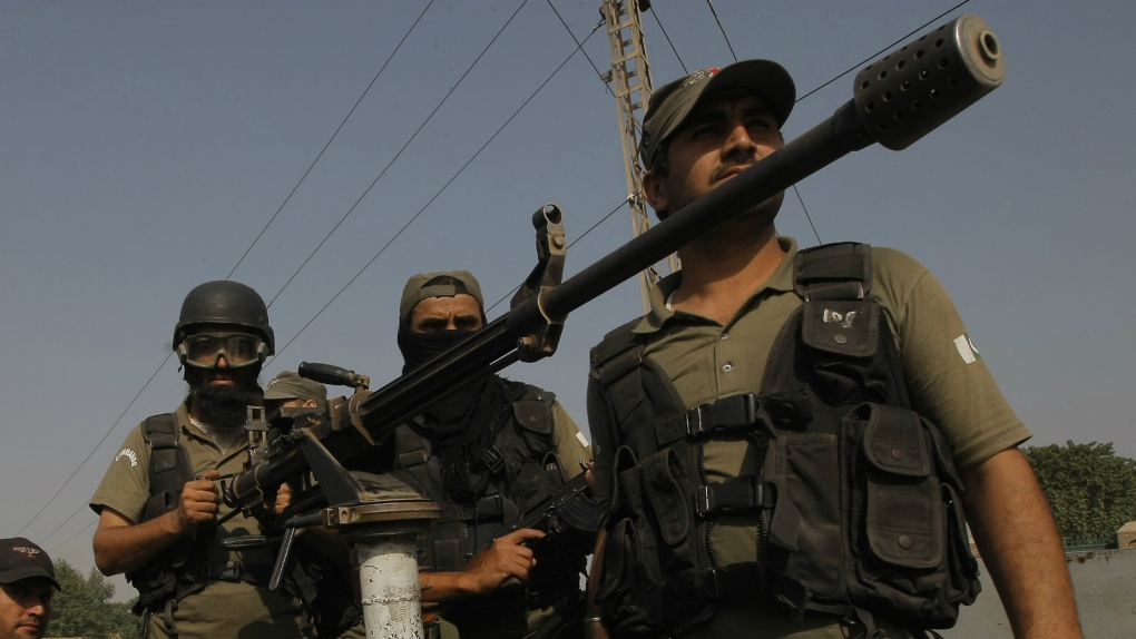 Pakistani soldiers guard base after attack