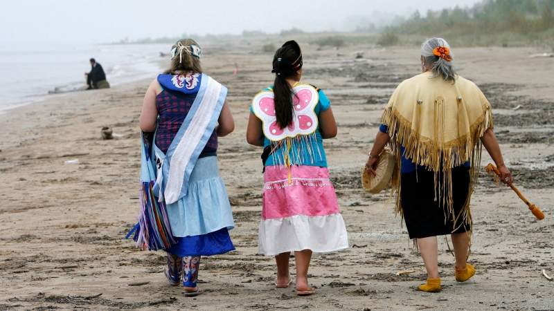 In this 2009 file photo, three women walk on Ipperwash beach near Forest, Ont. (THE CANADIAN PRESS/Dave Chidley)