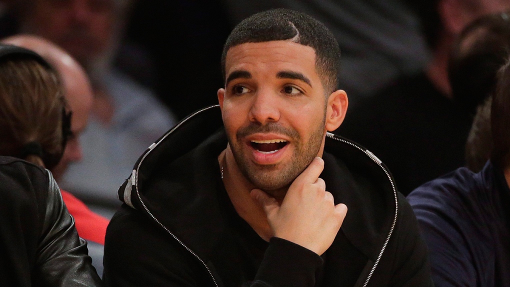 Drake attends an NBA basketball game